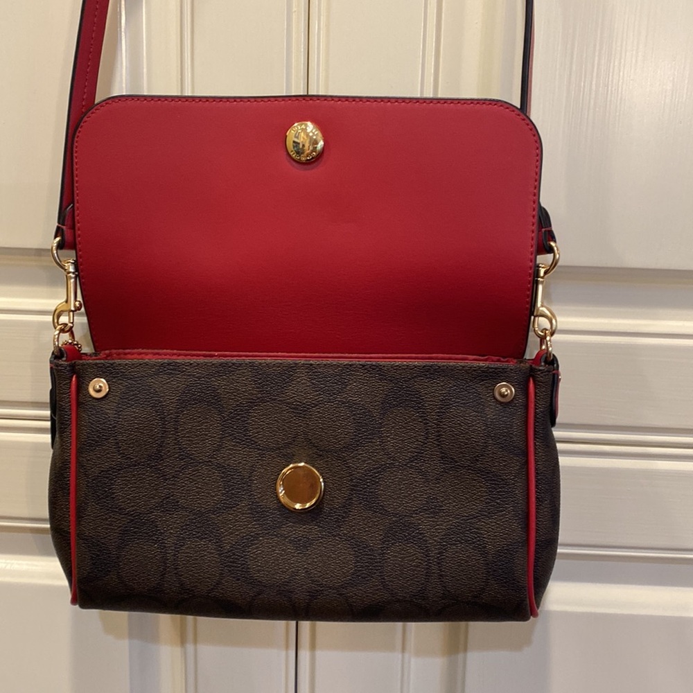This is a like new coach cross body bag. - Picture 4 of 9